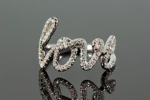 Diamond white gold cursive ring