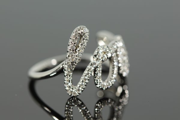 Diamond white gold cursive ring