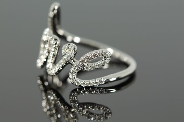 Diamond white gold cursive ring