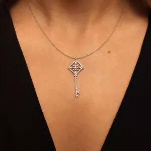 white gold pendant on neck
