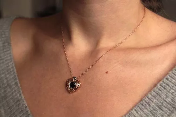 puffy heart necklace on neck