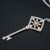 white gold key pendant