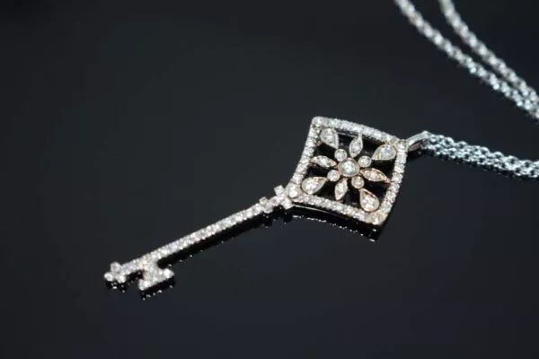 white gold key pendant